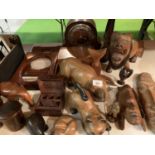AN ASSORTMENT OF TREEN TO INCLUDE VARIOUS ANIMALS AND TRIBAL MASKS ETC