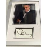 A FRAMED PHOTOGRAPH OF SPANISH OPERATIC TENOR JOSE CARRERAS AND HIS AUTOGRAPH