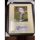 A LARGE FRAMED AND SIGNED COLOUR PHOTOGRAPH OF BRITISH GOLFER IAN POULTER COMPLETE WITH