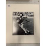 A MOUNTED SIGNED PHOTOGRAPH OF WELSH RUGBY PLAYER J P R WILLIAMS COMPLETE WITH CERTIFICATE OF
