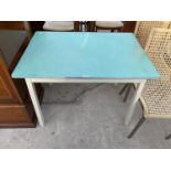 A FORMICA TOPPED KITCHEN TABLE