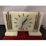 AN ART DECO STYLE MARBLE MANTEL CLOCK WITH WHITE METAL DETAIL (SLIGHT A/F ON THE BASE)