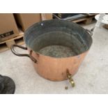 A VERY LARGE COPPER WASHING VESSEL WITH A BRASS TAP, CAST IRON HANDLES AND GALVANISED INNER