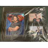 THREE PHOTOGRAPHS OF HENRY CAVILL AS SUPERMAN, ONE SIGNED, MOUNTED ON BOARD. WITH CERTIFICATE OF