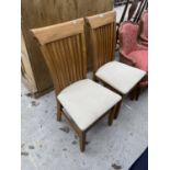 A PAIR OF MODERN OAK DINING CHAIRS