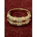 A 9CT GOLD DIAMOND RING