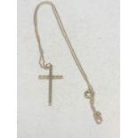 A 9 CARAT GOLD NECKLACE WITH CROSS PENDANT WEIGHT 2.8g