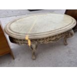 A LOW IVORY COLOURED COFFEE TABLE