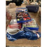 AN ASSORTMENT OF COMPUTER AND PLAYSTATION 4 GAMES AND A SIGNED FOOTBALL BOOT ETC