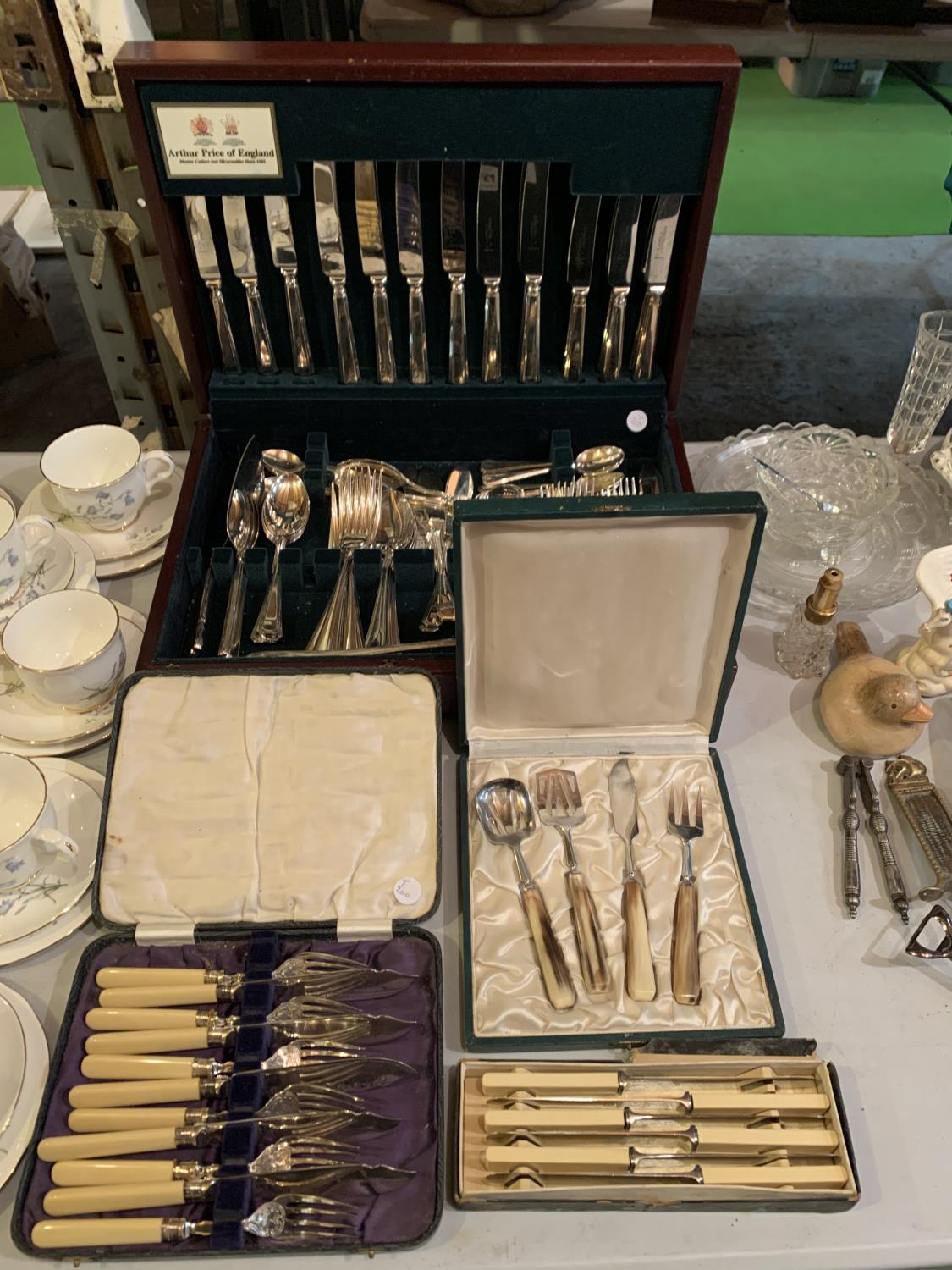 A WOODEN CANTEEN OF FLATWARE BY ARTHUR PRICE AND THREE FURTHER BOXES OF FLATWARE TO INCLUDE A FISH