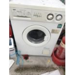 A WHITE ZANUSSI WASHING MACHINE BELIEVED IN WORKING ORDER BUT NO WARRANTY