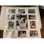 A MOUNTED GALLERY OF COLOUR PHOTOGRAPHS OF RACING CHAMPION LEWIS HAMILTON, ONE SIGNED COMPLETE