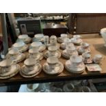 A LARGE SELECTION OF BONE CHINA TO INCLUDE TRIOS AND SOUP BOWLS ETC
