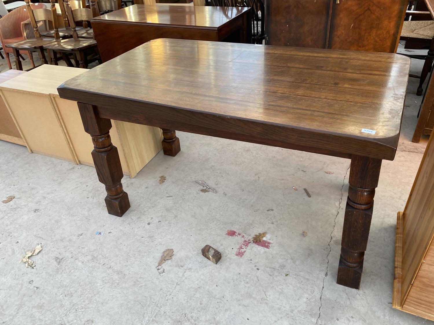 AN OAK REFECTORY STYLE DINING TABLE