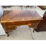 A MAHOGANY LOWBOY ON CABRIOLE SUPPORTS WITH FOUR DRAWERS