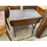 AN OAK DROP LEAF TEA TROLLEY