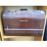 A VINTAGE SINGER SEWING MACHINE