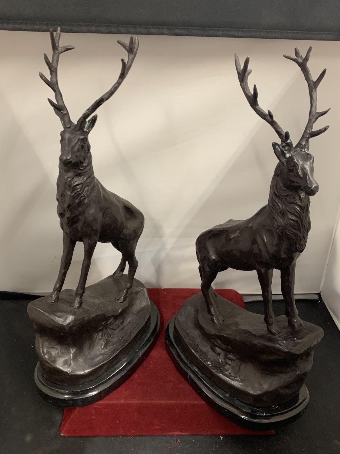 AN IMPRESSIVE PAIR OF BRONZE STAGS SIGNED J MOIGNIEZ