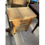 A MODERN OAK TWO DRAWER BEDSIDE TABLE