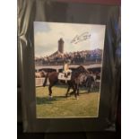 A SIGNED PICTURE OF LESTER PIGGOT ON NIJINSKY IN A MOUNT COMPLETE WITH CERTIFICATE OF AUTHENTICITY