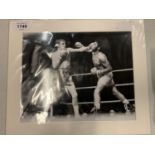 A MOUNTED BLACK AND WHITE PHOTGRAPH SIGNED BY BOXER LEN BUCHANAN COMPLETE WITH CERTIFICATE OF