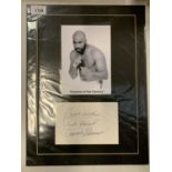 A MOUNTED PHTOGRAPH OF AMERICAN BOXER EARNIE SHAVERS AND HIS AUTOGRAPH COMPLETE WITH CERTIFICATE