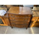 A REPRODUCTION WALNUT SERPENTINE FRONT CHEST OF FOUR DRAWERS, ON CABRIOLE LEGS, 26" WIDE