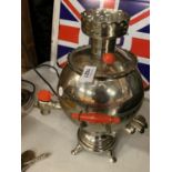 A VINTAGE RUSSIAN 'CAMORAP KUNUT' STAINLESS STEEL AND BAKELITE SAMOVAR IN THE FORM OF A COCKEREL