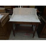 A VICTORIAN WASH STAND WITH MARBLE TOP AND GALLERIED BACK