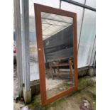 A LARGE WOODEN FRAMED WALL MIRROR 105CM X 205CM