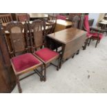 AN EARLY 20TH CENTURY OAK JACOBEAN STYLE GATELEG DINING TABLE AND FOUR CHAIRS WITH SPLIT CANE BACKS