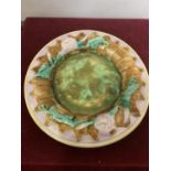 A MAJOLICA PLAQUE SIX INCHES DIAMETER