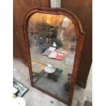 A LARGE WOODEN FRAMED WALL MIRROR
