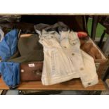A VINTAGE SUITCASE CONTAINING AN ASSORTMENT OF RETRO AND VINTAGE CLOTHING TO INCLUDE A CAMEL COAT