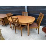 A RETRO TEAK EXTENDING DINING TABLE AND FOUR DINING CHAIRS