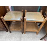 TWO OAK SIDE TABLES WITH GLASS TOPS AND LOWER SHELVES