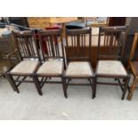 A SET OF FOUR EARLY 20TH CENTURY OAK DINING CHAIRS