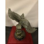 A RESIN FIGURE IN THE GREEK STYLE OF ICARUS DISGUISED AS AN EAGLE
