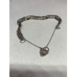 A SILVER BRACELET WITH HALLMARKED HEART CLASP MARKED SHEFFIELD SILVER