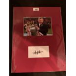 A PICTURE OF SIR ALEX FERGUSON WITH HIS AUTOGRAPH IN A MOUNT COMPLETE WITH CERTIFICATE OF