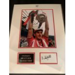 A PICTURE OF NORMAN WHITESIDE AND HIS AUTOGRAPH IN A MOUNT COMPLETE WITH CERTIFICATE OF AUTHENTICITY