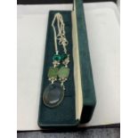 A SILVER NECKLACE WITH FIVE VARIOUS GREEN STONES MARKED 925 WITH A PRESENTATION BOX