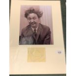 A MOUNTED BLACK AND WHITE PHOTOGRAPH OF COMEDY ICON KEN DODD WITH AUTOGRAPH