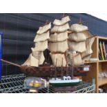 THREE VARIOUS SIZED MODEL SHIPS TO INCLUDE A LARGE WOODEN SAILING SHIP ON WOODEN PLINTH ETC