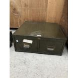 A VINTAGE METAL TWO DRAWER MINIATURE FILING CABINET