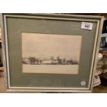 A SIGNED AND FRAMED PRINT OF A SNOWY HILL SCENE