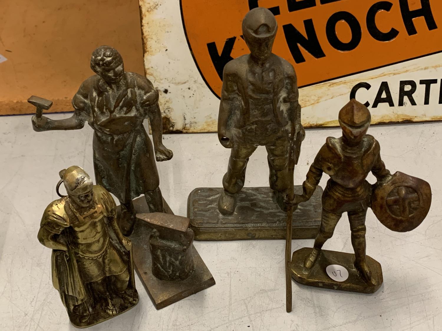 FOUR BRASS FIGURINES TO INCLUDE A BLACKSMITH AND A MINER