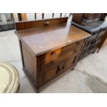 AN OAK CABINET WITH TWO DOORS, TWO DRAWERS AND SPLASHBACK