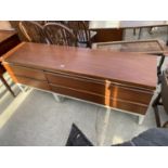 A B.C.M. (BATH CABINET MAKERS) RETRO TEAK SIDEBAORD ENCLOSING FOUR DRAWERS, 64" WIDE