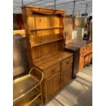 A MODERN PINE DRESSER COMPLETE WITH PLATE RACK, 37" WIDE